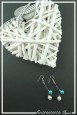 boucles-d-oreilles-en-fil-cable-dante-couleur-turquoise-et-blanc-sur-fond-noir