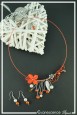 parure-de-bijoux-popi-couleur-orange-et-argent-sur-fond-noir