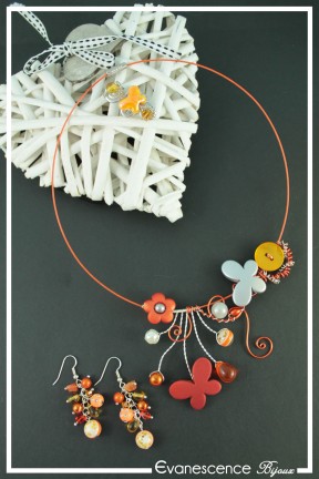 parure-de-bijoux-maya-couleur-orange-et-argent-sur-fond-noir