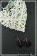 boucles-d-oreilles-arsouille-couleur-noir-et-rouge-sur-fond-noir