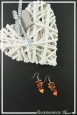 boucles-d-oreilles-chaine-iloa-couleur-orange-sur-fond-noir